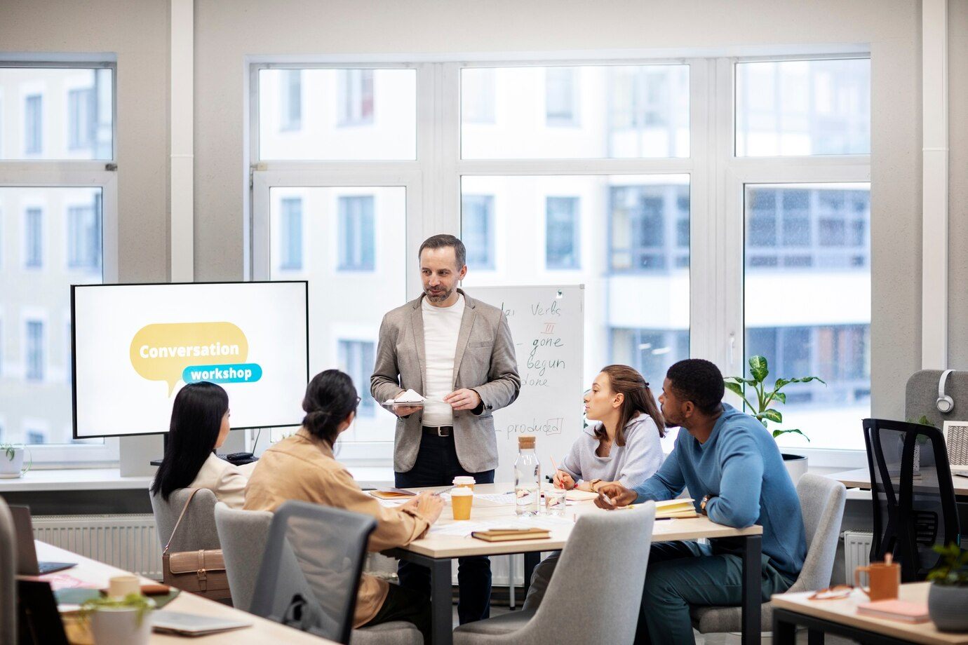 Professor facilitating a negotiation training with students
